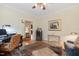 Comfortable living room with hardwood floors, neutral tones, a ceiling fan, and classic décor at 101 Cardiff Pl, Chapel Hill, NC 27516