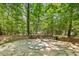 Stone tile area surrounded by trees. Ideal for nature and contemplation at 101 Cardiff Pl, Chapel Hill, NC 27516