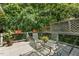 Private patio surrounded by lush greenery offers a peaceful outdoor retreat at 101 Cardiff Pl, Chapel Hill, NC 27516