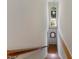Interior view of a staircase featuring a unique arched window providing natural light at 101 Cardiff Pl, Chapel Hill, NC 27516