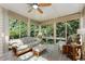 Relaxing sunroom with natural light and serene views of the surrounding greenery at 101 Cardiff Pl, Chapel Hill, NC 27516
