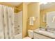 Bathroom includes a shower with patterned shower curtain and vanity with granite countertop at 1019 Tranquil Crk Way, Wake Forest, NC 27587