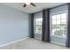 This bedroom features soft carpeting, neutral walls and a ceiling fan for added comfort at 1019 Tranquil Crk Way, Wake Forest, NC 27587