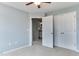 This secondary bedroom has light blue walls, carpet, closet, and ensuite bathroom access at 1019 Tranquil Crk Way, Wake Forest, NC 27587