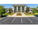 Beautiful community clubhouse featuring stone accents, large windows, and well-manicured landscaping at 1019 Tranquil Crk Way, Wake Forest, NC 27587