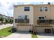 This two-story townhome includes a garage, deck and well-maintained green lawn at 1019 Tranquil Crk Way, Wake Forest, NC 27587