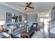 Comfortable living area showcasing modern decor and a seamless flow into other living spaces at 1019 Tranquil Crk Way, Wake Forest, NC 27587