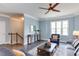 Bright and airy living room with hardwood floors, crown molding, and abundant natural light at 1019 Tranquil Crk Way, Wake Forest, NC 27587
