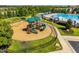 Community playground area with slides, swings, climbing structures, and safety mulch at 1019 Tranquil Crk Way, Wake Forest, NC 27587