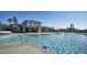Community pool and clubhouse with lounge chairs, shallow area and lifeguard station at 1019 Tranquil Crk Way, Wake Forest, NC 27587