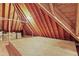 Unfinished attic space with exposed wooden beams and plywood flooring, ready for customization at 104 San Sophia Dr, Chapel Hill, NC 27514