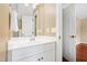 Clean, white bathroom vanity with a mirror and modern fixtures at 104 San Sophia Dr, Chapel Hill, NC 27514