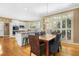 Bright dining area with a view of the white kitchen and backyard at 104 San Sophia Dr, Chapel Hill, NC 27514