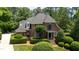 Charming brick home with lush, manicured landscaping and a welcoming front entrance at 104 San Sophia Dr, Chapel Hill, NC 27514