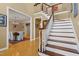 Inviting foyer showcasing staircase, hardwood floors and views into dining room at 104 San Sophia Dr, Chapel Hill, NC 27514