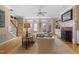 Warm and inviting living room with hardwood floors, fireplace and built-in shelving at 104 San Sophia Dr, Chapel Hill, NC 27514