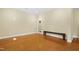 Open living room features wood floors and a bench, great for entertaining at 104 San Sophia Dr, Chapel Hill, NC 27514