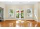 Bright living room features French doors and a view of the outdoor patio at 104 San Sophia Dr, Chapel Hill, NC 27514