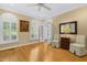 Bright home office with hardwood floors, neutral walls, and a ceiling fan at 104 San Sophia Dr, Chapel Hill, NC 27514