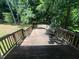 Large wooden deck with built-in seating, perfect for outdoor entertaining at 109 Hidden Farm Ln, Holly Springs, NC 27540