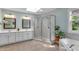 Bright bathroom with double vanity, glass shower, and soaking tub at 1123 Poplar Forest Ln, Pittsboro, NC 27312