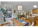 Cozy dining area with a large window, wooden table, and decorative pendant light at 1123 Poplar Forest Ln, Pittsboro, NC 27312