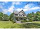 Charming two-story home with a welcoming front porch and manicured landscaping at 1123 Poplar Forest Ln, Pittsboro, NC 27312