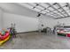A spacious garage features ample storage, a kayak, and bikes, providing room for hobbies at 1123 Poplar Forest Ln, Pittsboro, NC 27312