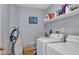 Functional laundry room with washer, dryer, sink, and ample storage space, perfect for handling household chores at 1123 Poplar Forest Ln, Pittsboro, NC 27312