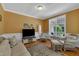 Bright living room with a large window and comfortable wicker seating at 1123 Poplar Forest Ln, Pittsboro, NC 27312