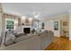 Spacious living room with a fireplace, comfortable seating, and built-in cabinets at 1123 Poplar Forest Ln, Pittsboro, NC 27312