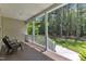 Relaxing back porch, complete with outdoor seating and views of the wooded backyard at 1123 Poplar Forest Ln, Pittsboro, NC 27312
