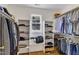 Organized walk-in closet with shelving and hanging storage for optimal space at 1123 Poplar Forest Ln, Pittsboro, NC 27312