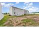 Backyard with a patio, some grass, and views of the back of the house at 1204 Bridgewater Dr, Durham, NC 27704