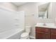 Bathroom includes tub, toilet and single sink vanity with mirror at 1204 Bridgewater Dr, Durham, NC 27704