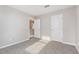 Carpeted bedroom with two doors and natural light provides a welcoming space at 1204 Bridgewater Dr, Durham, NC 27704