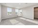 Spacious bedroom with carpet and great natural light offers a serene living space at 1204 Bridgewater Dr, Durham, NC 27704