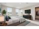 Bedroom featuring plush carpeting, two windows, and a closet at 1204 Bridgewater Dr, Durham, NC 27704