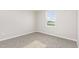 Carpeted bedroom with a window offers a bright and pleasant space at 1204 Bridgewater Dr, Durham, NC 27704