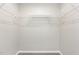Walk-in closet features ample shelving for organized storage at 1204 Bridgewater Dr, Durham, NC 27704