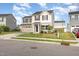 Two-story house boasting a two-car garage, complemented by a neat lawn and simple landscaping at 1204 Bridgewater Dr, Durham, NC 27704