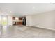 Open kitchen area with wood cabinets and appliances, connected to a spacious living area at 1204 Bridgewater Dr, Durham, NC 27704