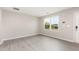 Neutral living room featuring a large window, and contemporary wood look flooring at 1204 Bridgewater Dr, Durham, NC 27704