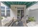 Cozy outdoor patio with covered seating area, perfect for relaxing or entertaining guests at 12227 Orchardgrass Ln, Raleigh, NC 27614