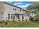 A lovely home backyard showcasing a covered patio, small garden, and lush green grass at 12227 Orchardgrass Ln, Raleigh, NC 27614