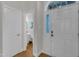 Bright foyer featuring hardwood floors, a half bath, and a view into the home at 12227 Orchardgrass Ln, Raleigh, NC 27614