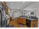Functional kitchen featuring ample counter space, wood cabinets, and convenient access to the breakfast area at 12227 Orchardgrass Ln, Raleigh, NC 27614