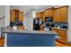 Well-equipped kitchen with ample counter space, wood cabinets, and an open layout for easy meal preparation at 12227 Orchardgrass Ln, Raleigh, NC 27614