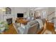 Comfortable living room featuring hardwood floors, fireplace, and an open floor plan perfect for entertaining at 12227 Orchardgrass Ln, Raleigh, NC 27614