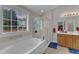 The main bathroom has a garden tub and a glass enclosed shower at 12227 Orchardgrass Ln, Raleigh, NC 27614